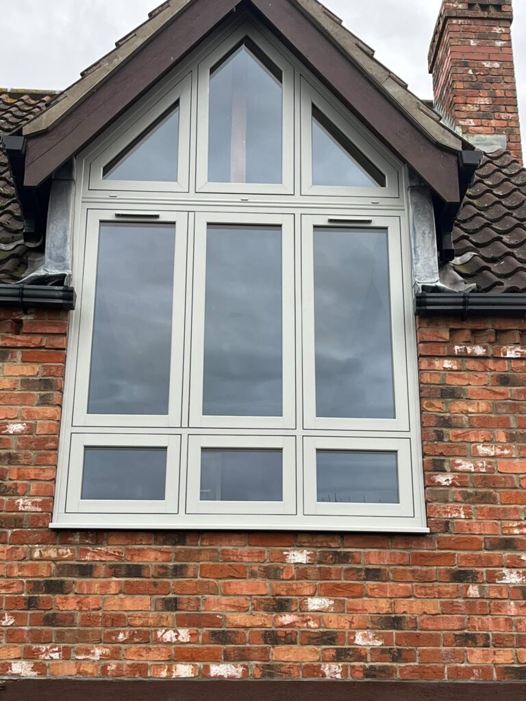 UPVC Casement Windows 29 White uPVC gable-end window with triangular upper glazing and six rectangular lower sections